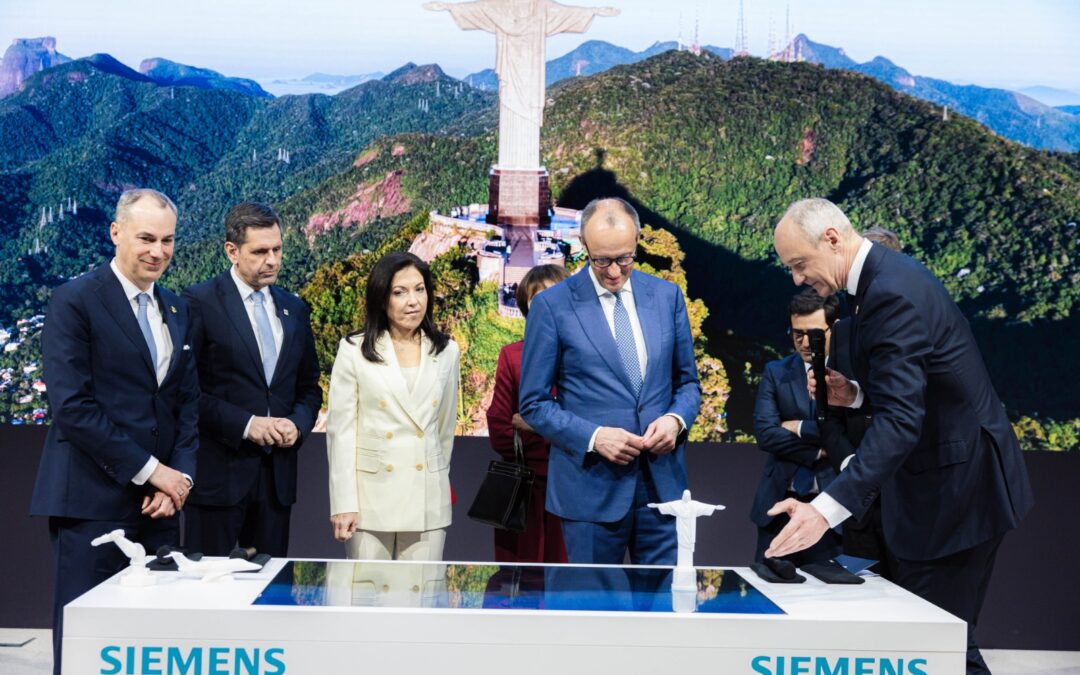 Com chanceler alemão no palco, Siemens homenageia Brasil com imagem do Cristo Redentor para demonstrar Inteligência Artificial Industrial na Hannover Messe 2026